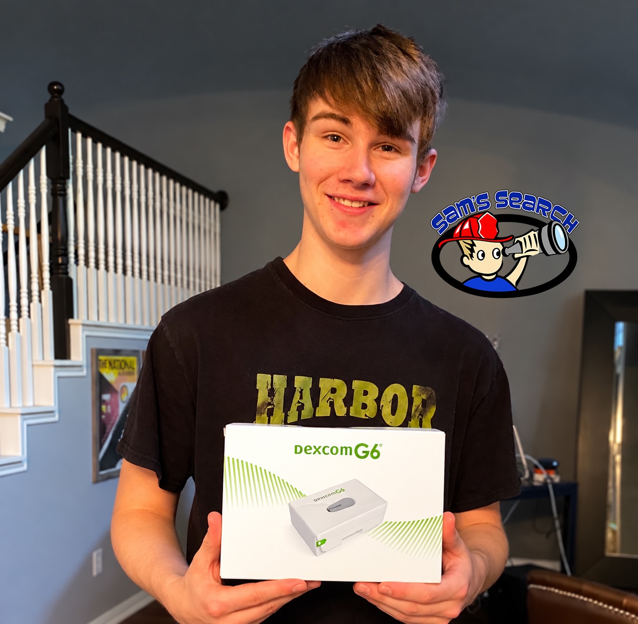 Teen holding Dexcom G6 continuous glucose monitor