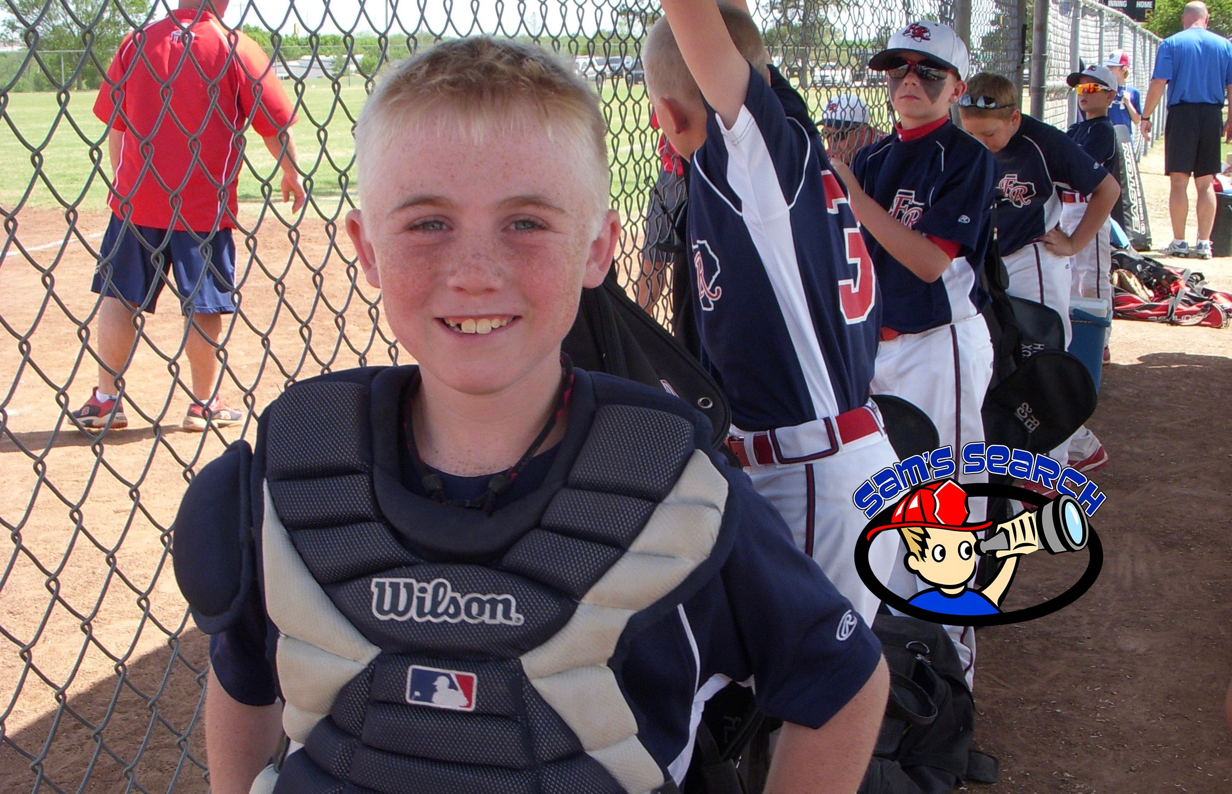 Tyler in baseball gear smiling